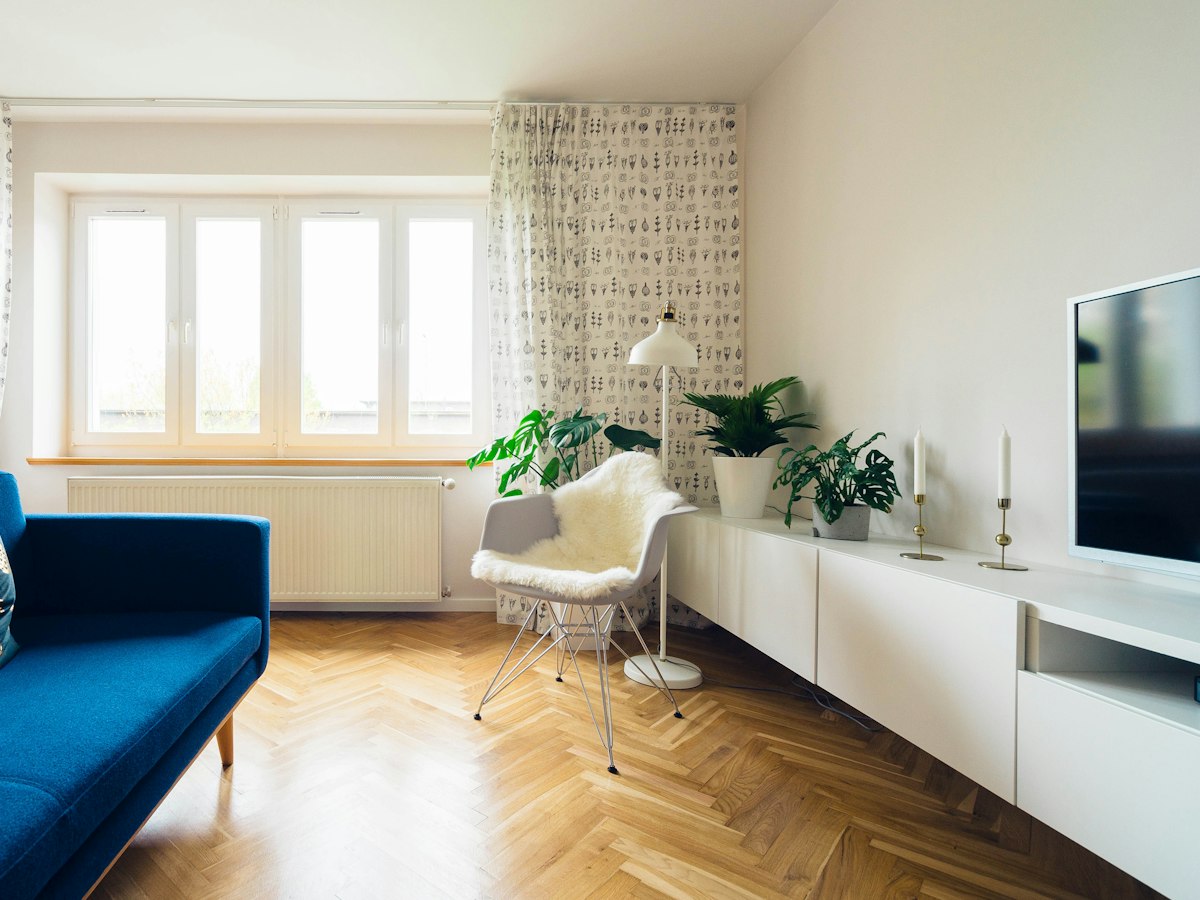 Bright living room with large white-framed windows